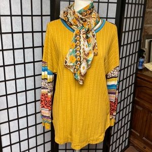 Beautiful color blocked sweater. Size large, long sleeves cuffed.